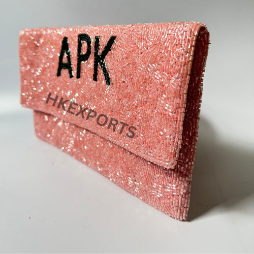 Whimsical Pink Beaded Purse with APK Charm – A Playful Fusion of Elegance and Character