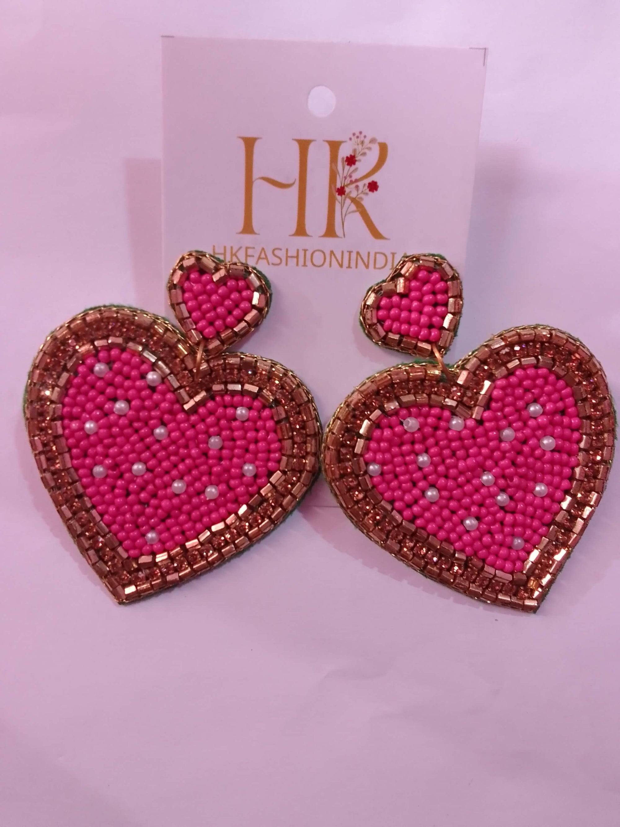 Fall in love with these adorable pink and gold beaded earrings
